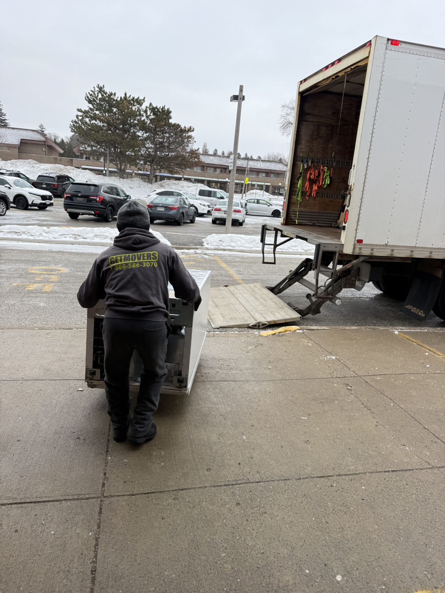 Professional movers maintaining clear pathways during the loading process in a Chapel Hill North home.