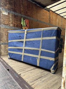 Movers carefully preparing furniture for a home move from Downtown Halifax to Fairview, ensuring safe winter transit.