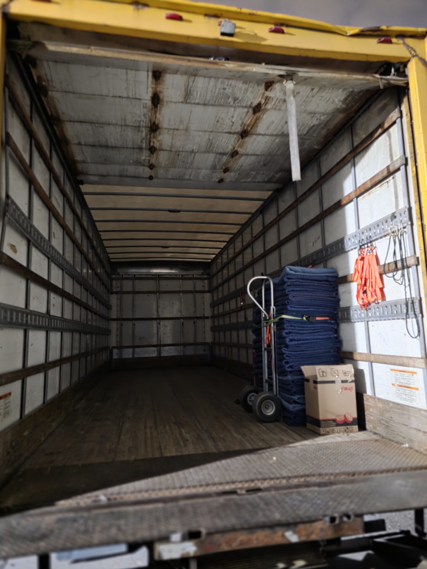 Movers maintaining clear pathways during the winter loading process in London.