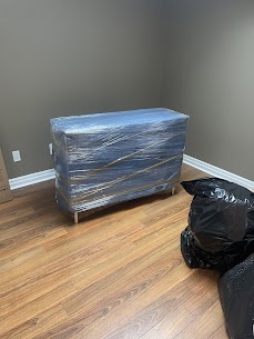 Movers carefully preparing furniture for a home move from Downtown Brantford to Terrace Hill, ensuring safe winter transit.