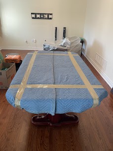 Larger furniture wrapped and secured for transit during a residential move in Oshawa.
