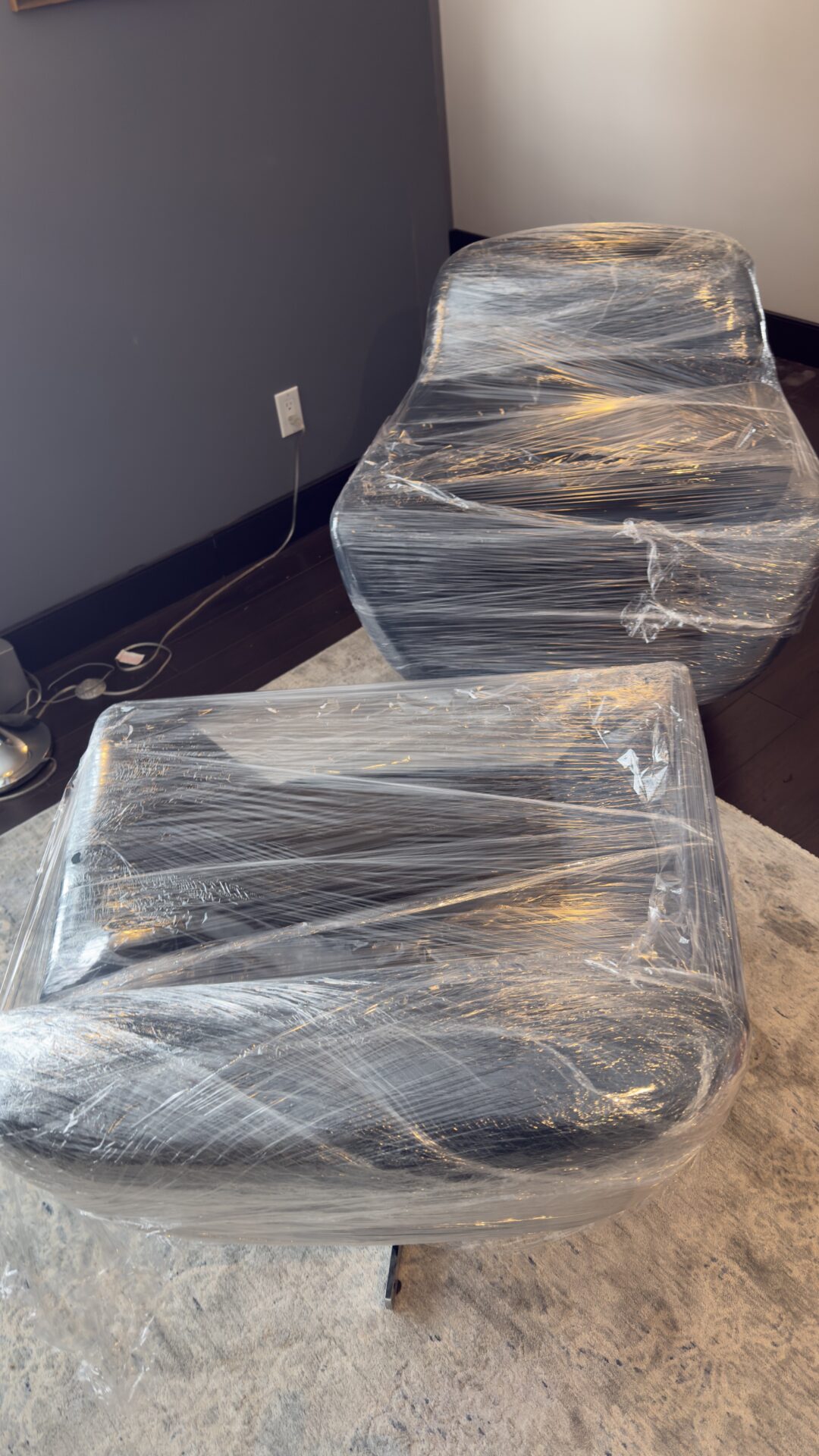 Delicate dessert plates being packed into reinforced divider crates.