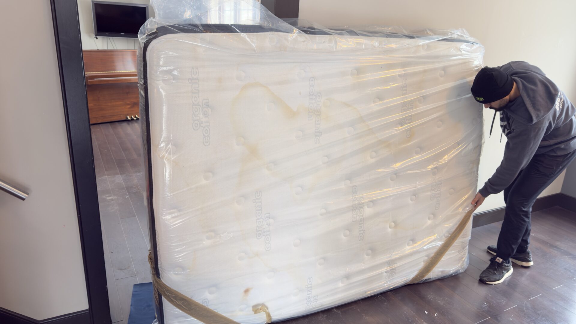 Professional movers maintaining clear pathways during the loading process in a Hamilton home.