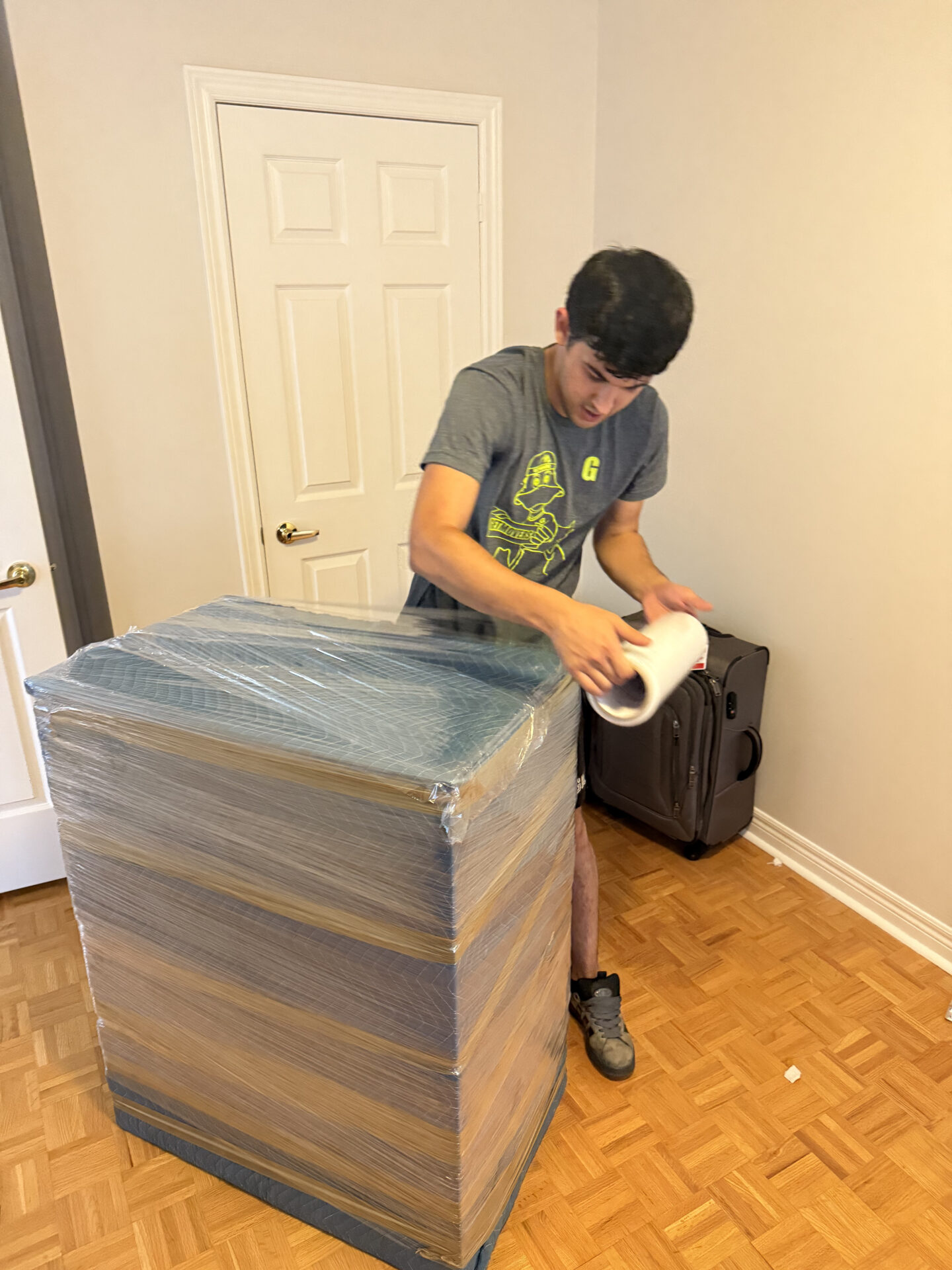 Professional movers maintaining clear pathways during the loading process in a Shearwater home.