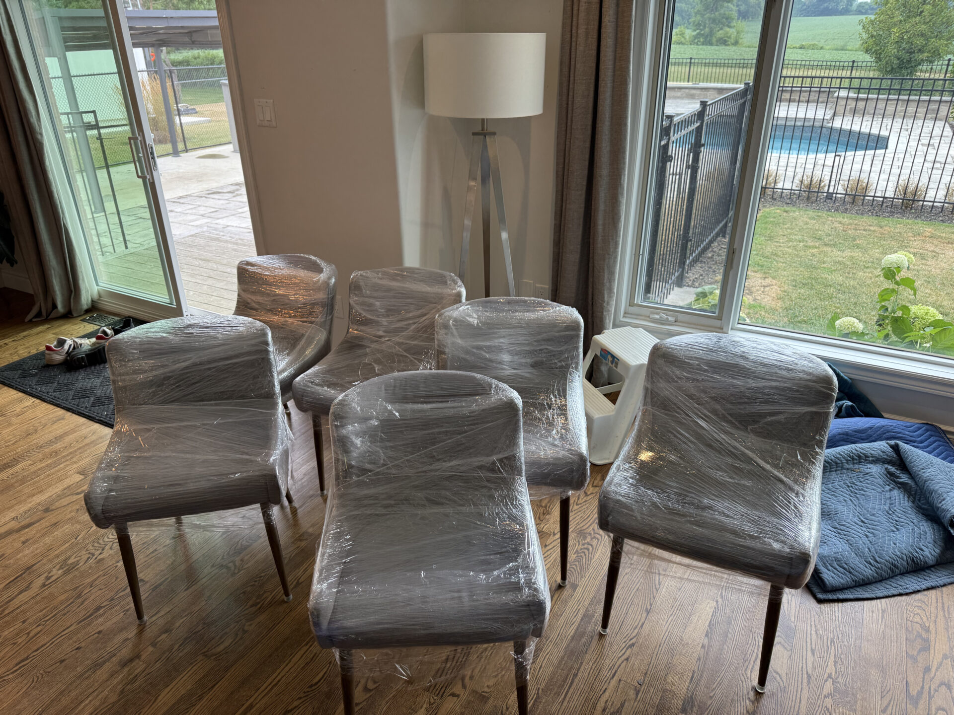 Professional movers maintaining clear pathways during the loading process in a Guildwood home.