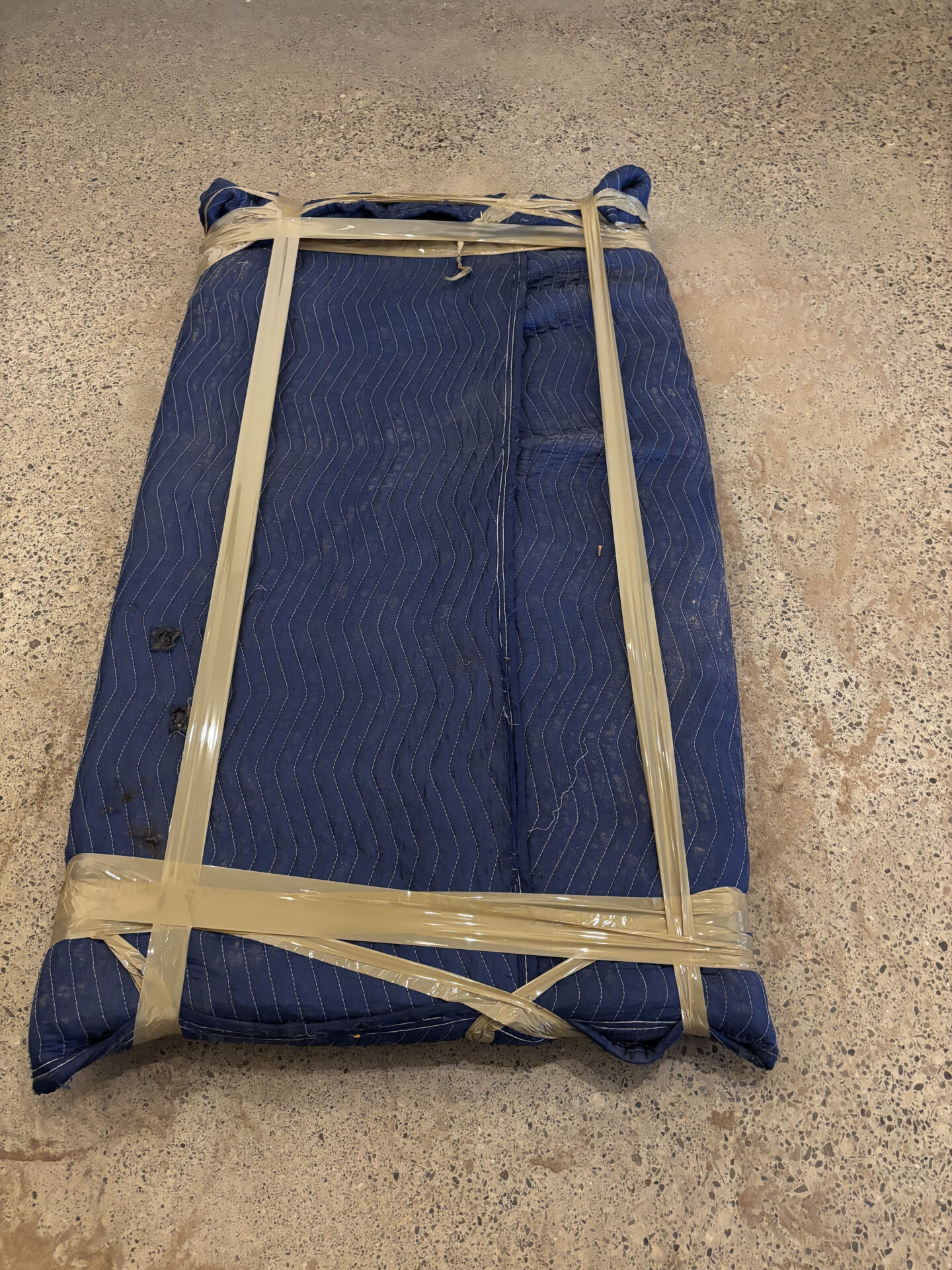 Porcelain cups packed in cushioned sleeves and divider crates for transit to Pinecrest.