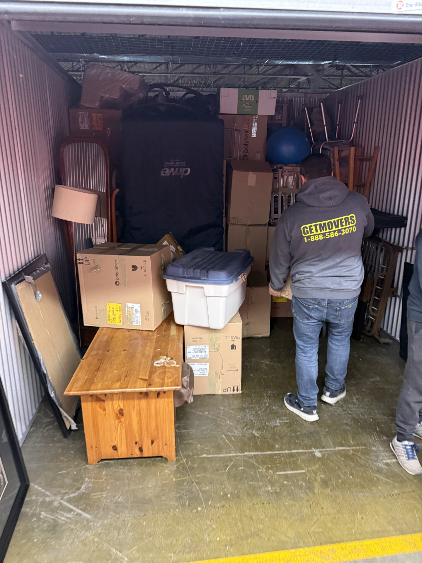 Professional movers maintaining clear pathways during the loading process in a Cleardale home.