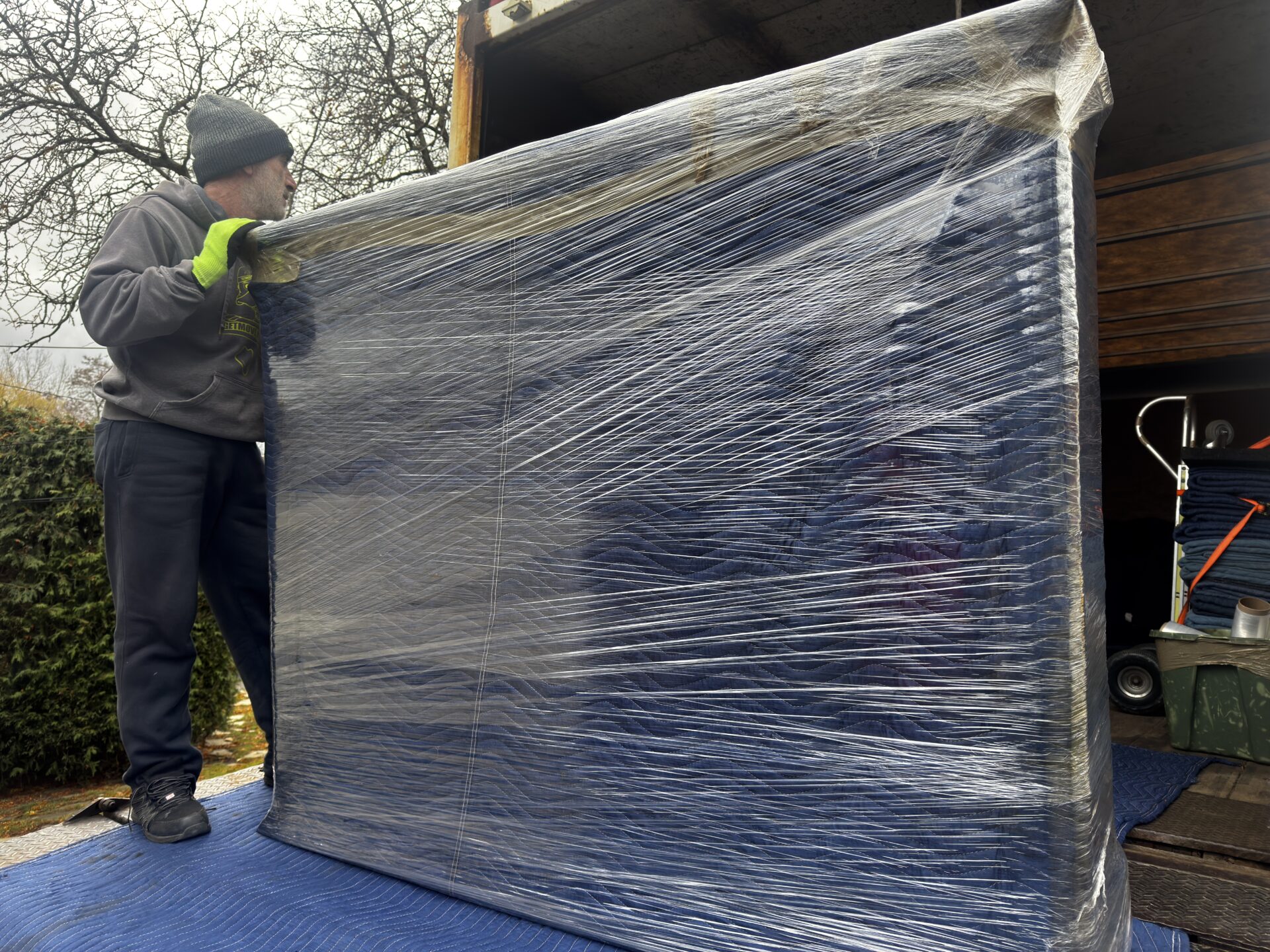 Professional movers maintaining clear pathways during the loading process in a Big Cedar Point home.