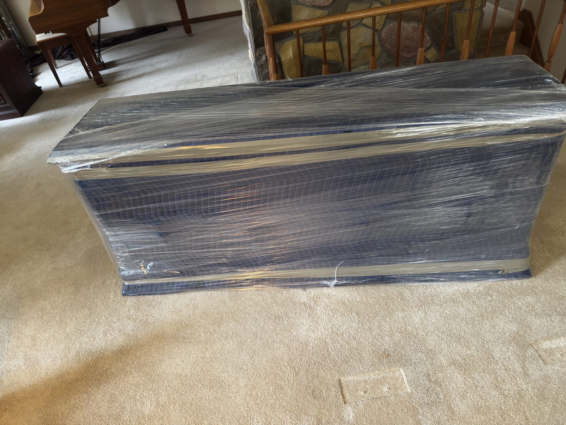 Movers reorganizing storage items at the new Stroud location to help the client settle in.