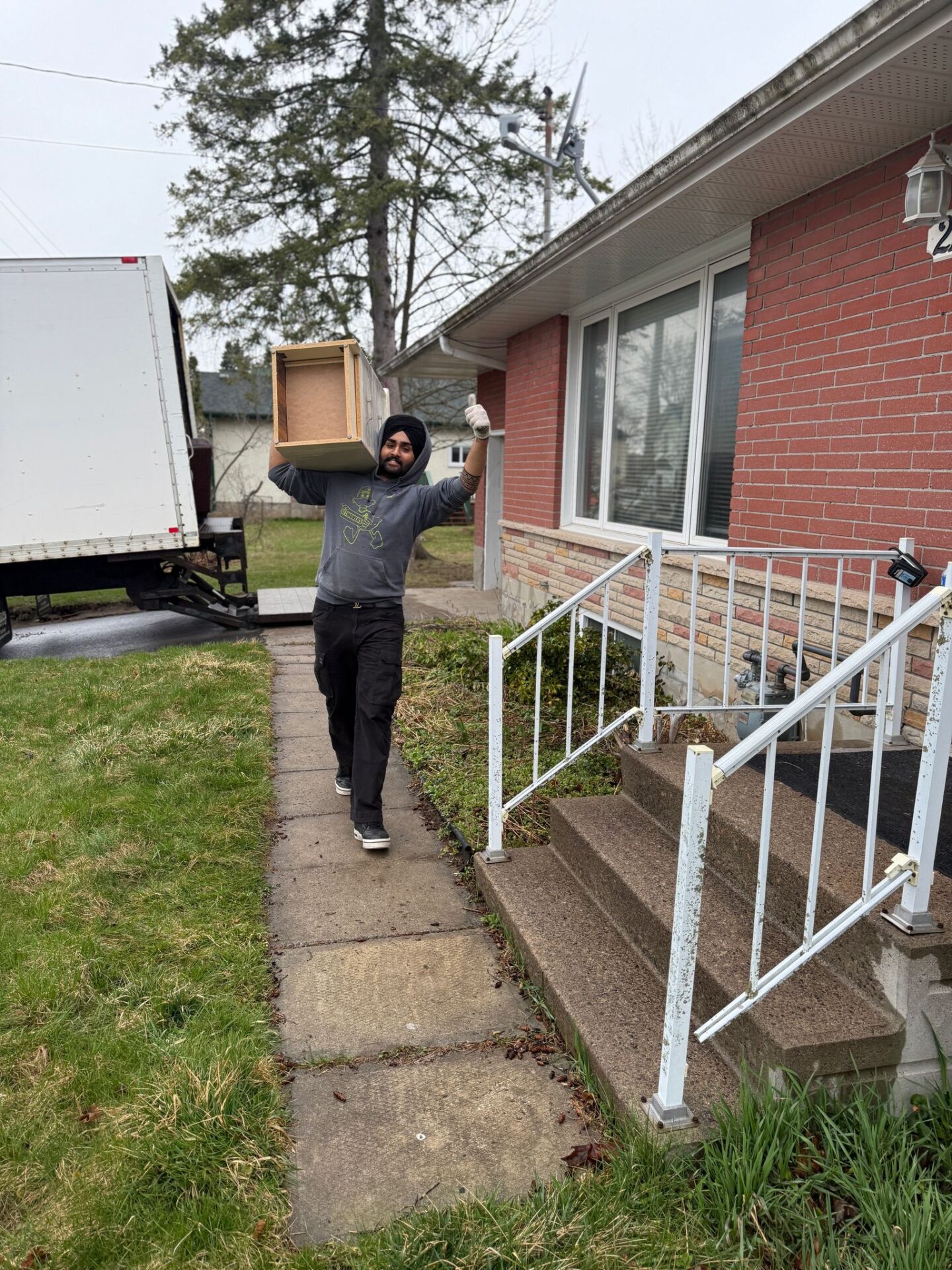 Movers wrapping furniture in Dorset Park