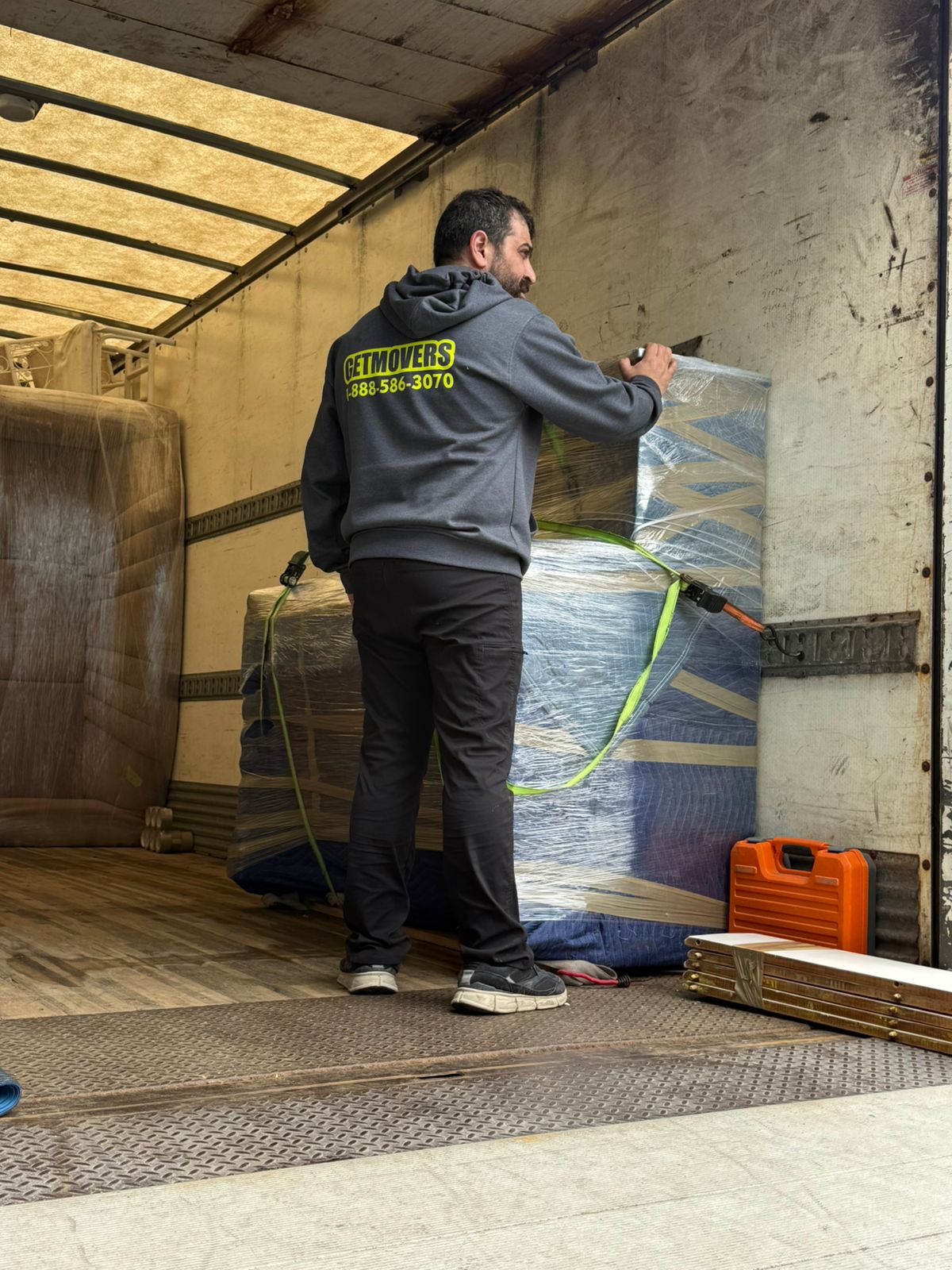 Hydrostone move completed — crew loading townhouse