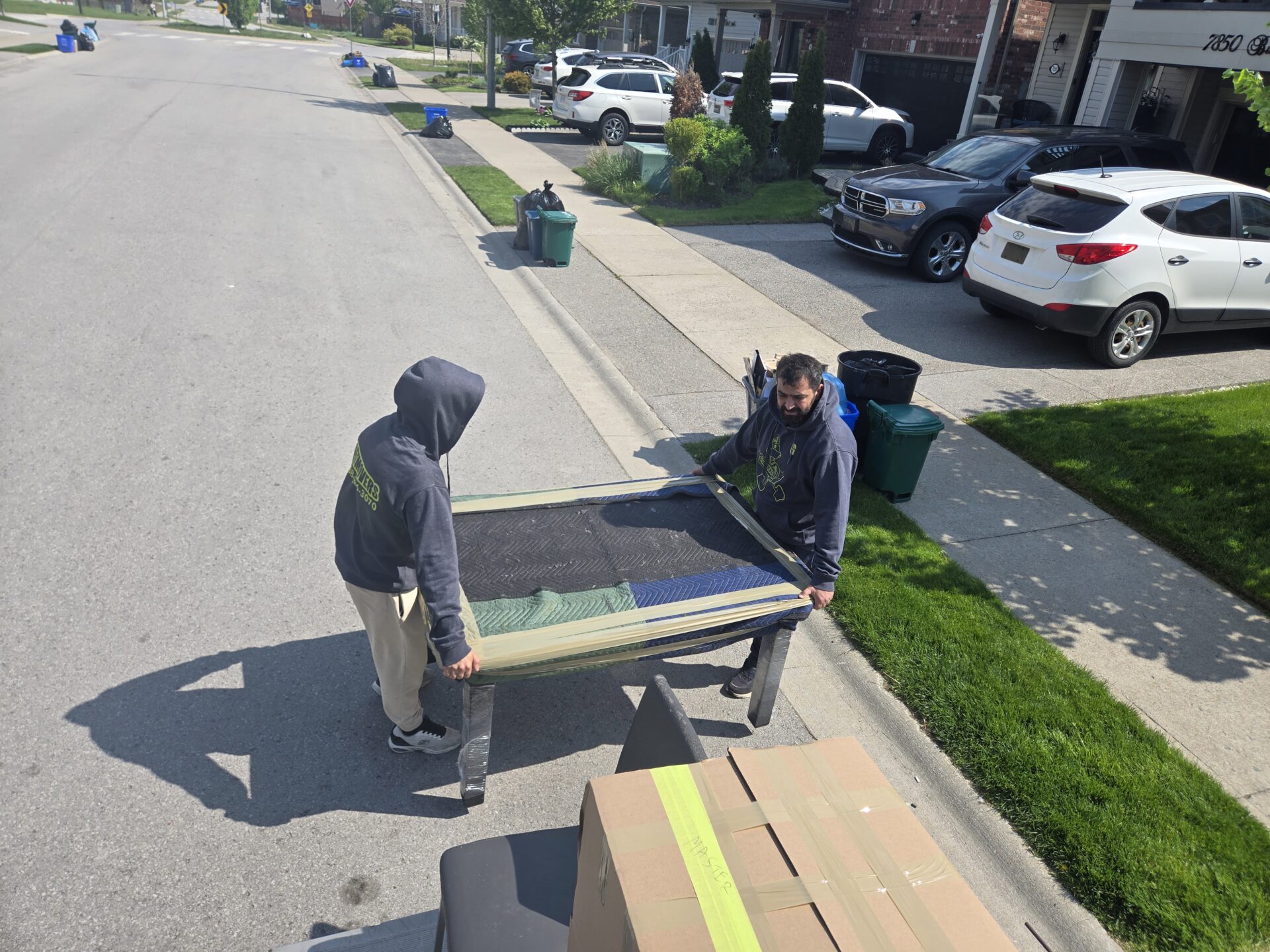 Movers loading truck in Fall River Village