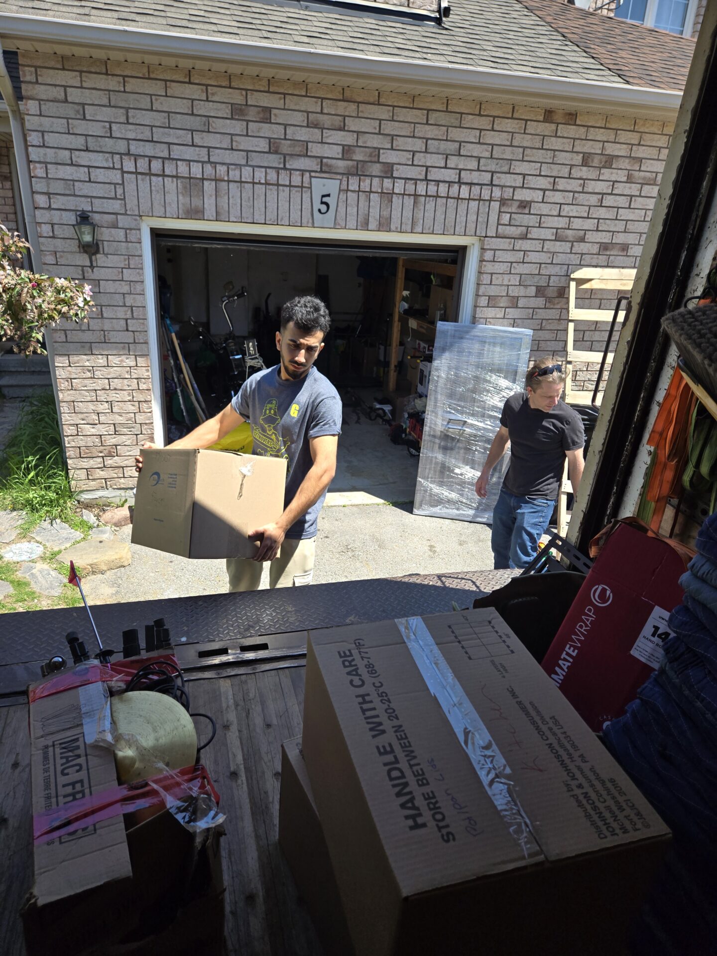 Oakfield move completed — crew loading house