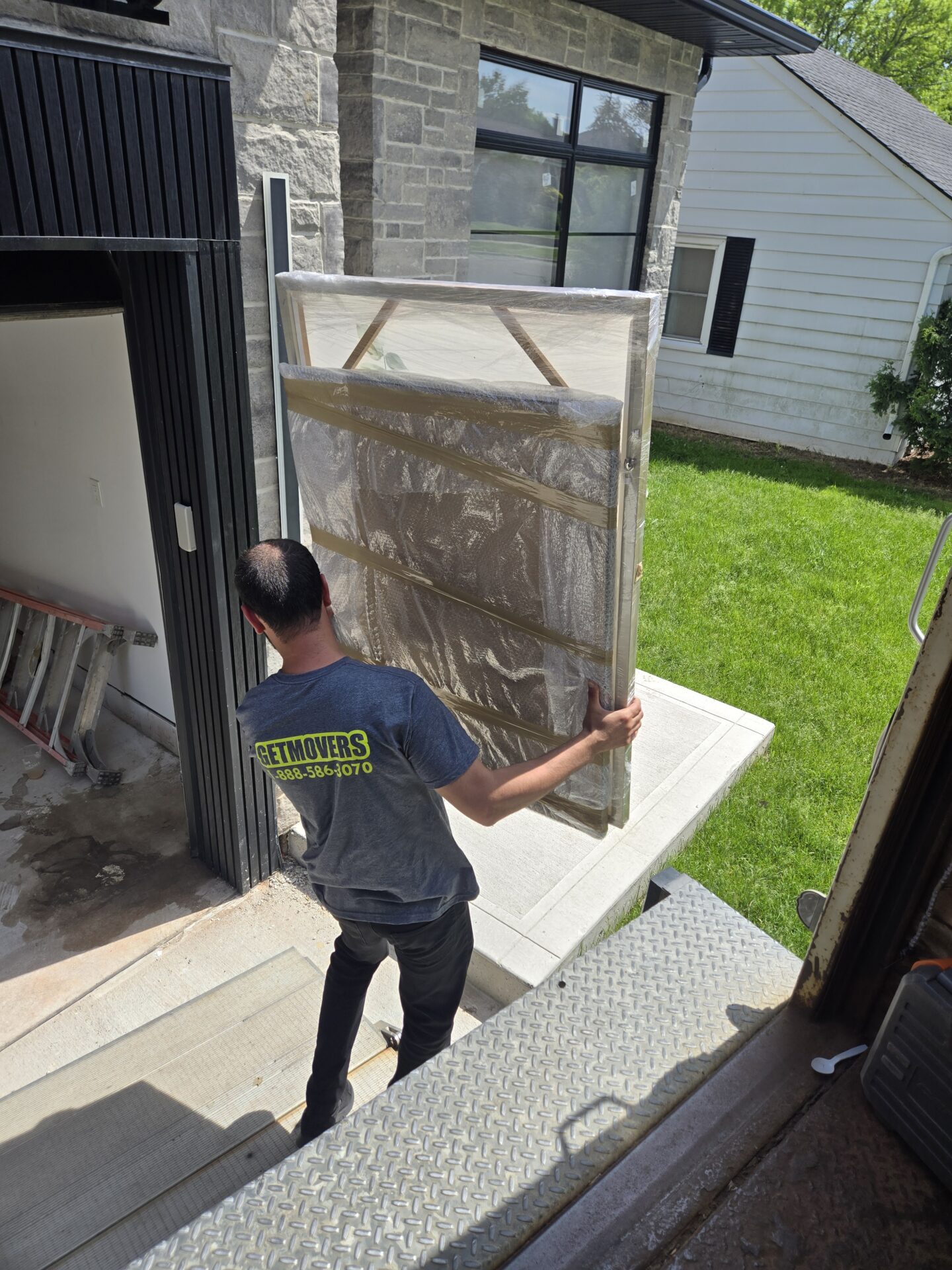 Movers delivering belongings to Bedford home