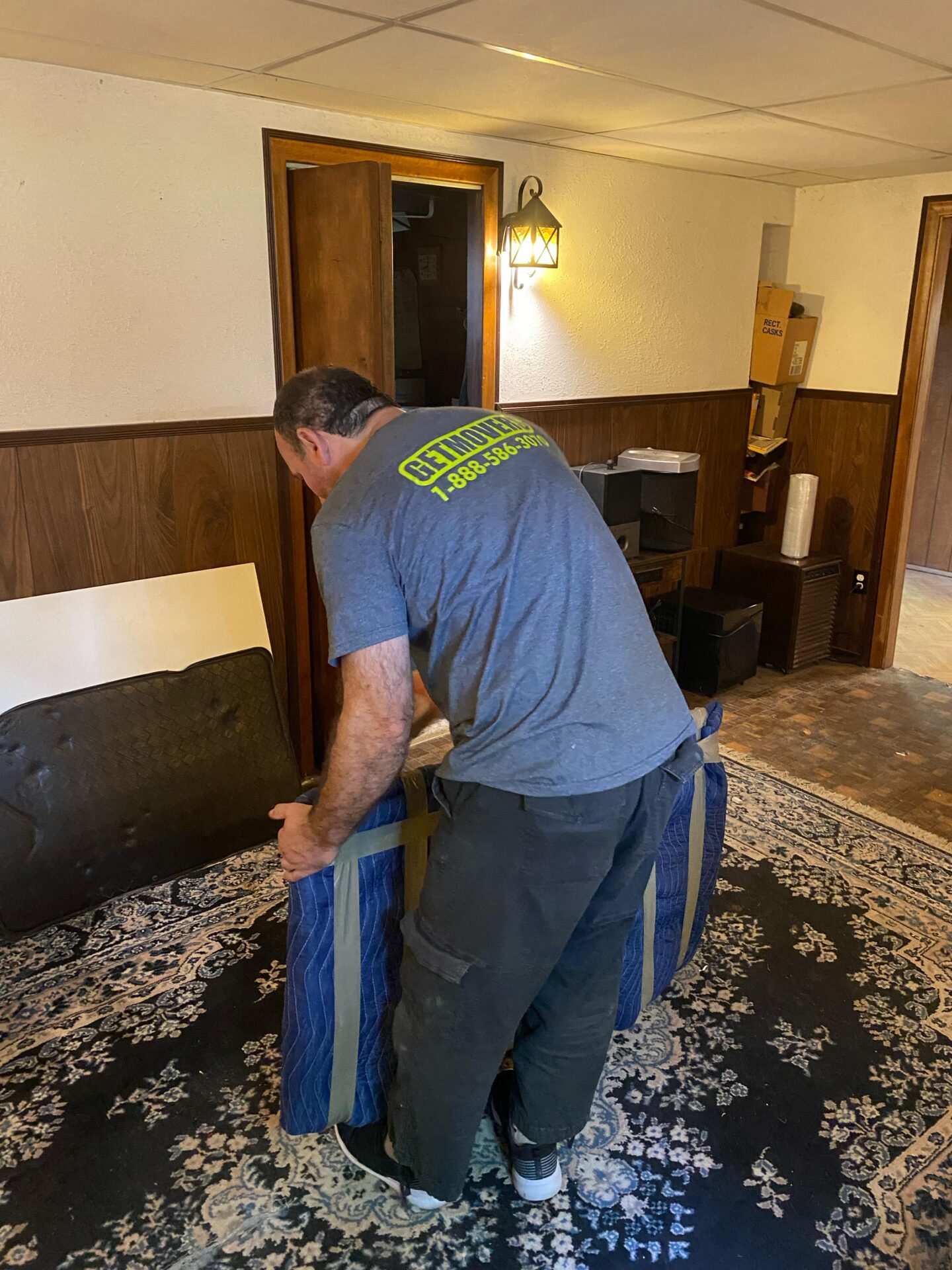 Movers carrying furniture out of a Portuguese Cove home