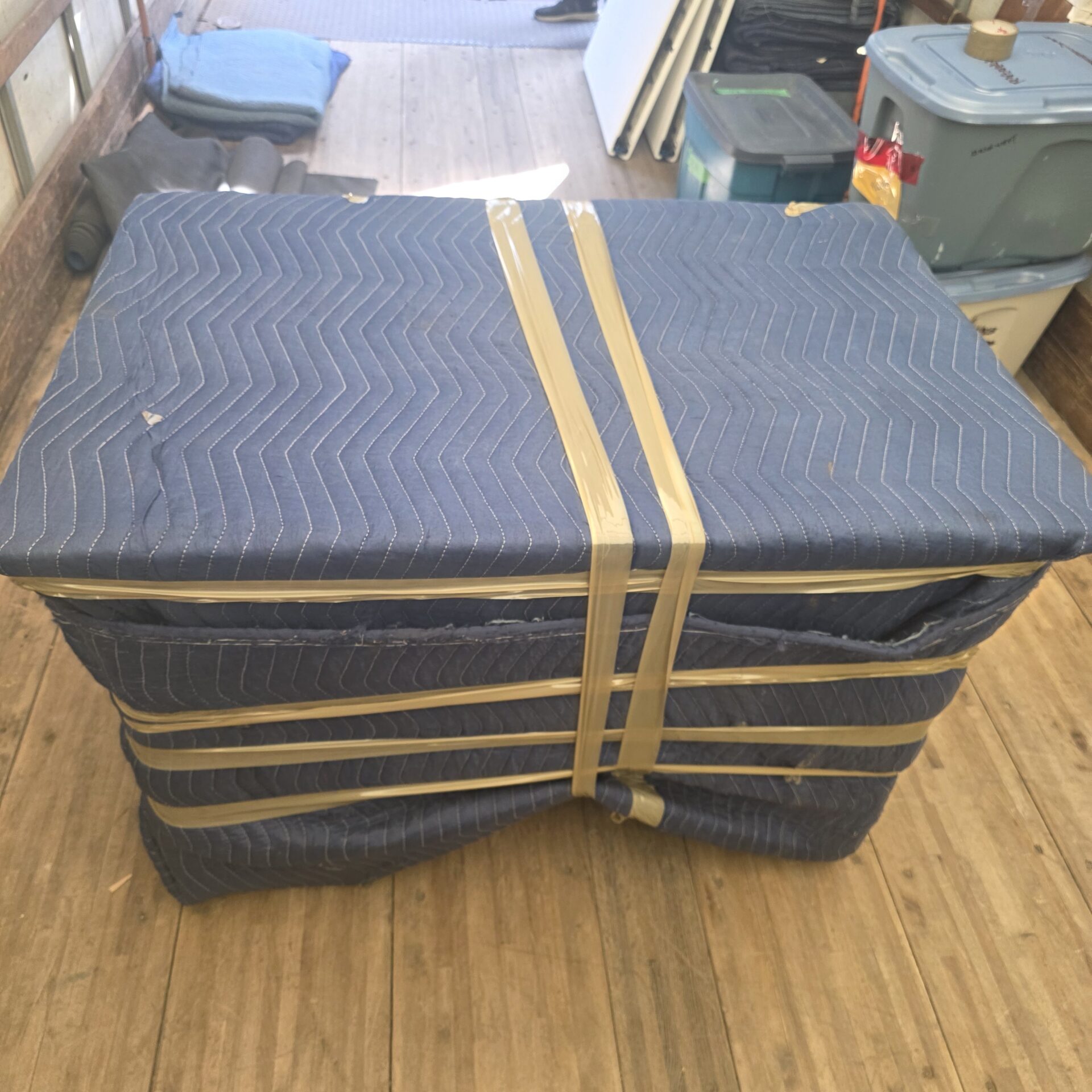 Kentville movers wrapping antique furniture