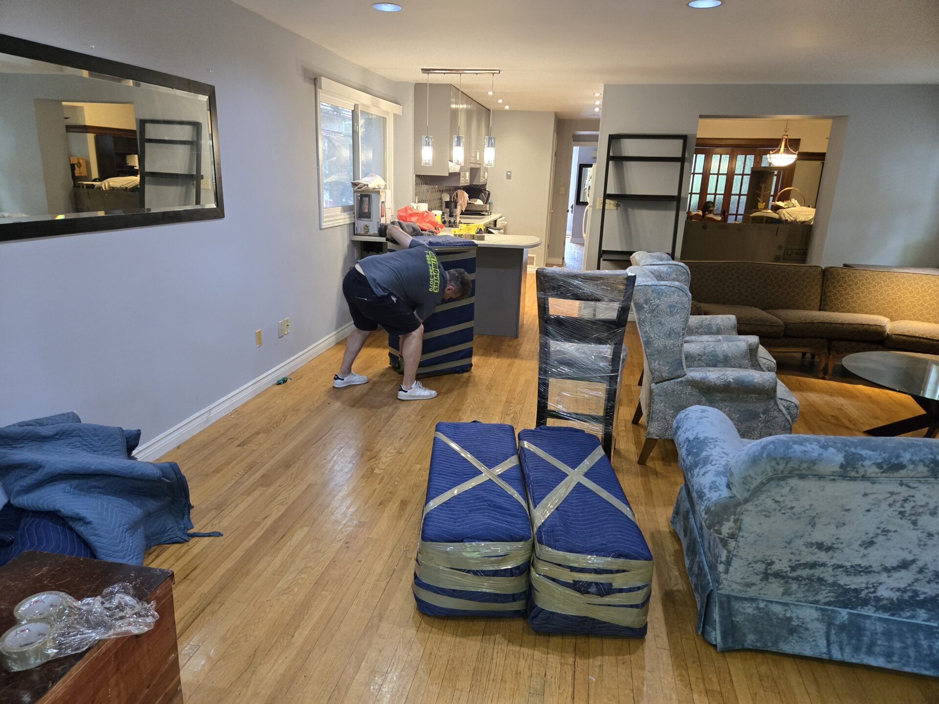 Movers handling narrow townhouse stairs in eastern Oshawa