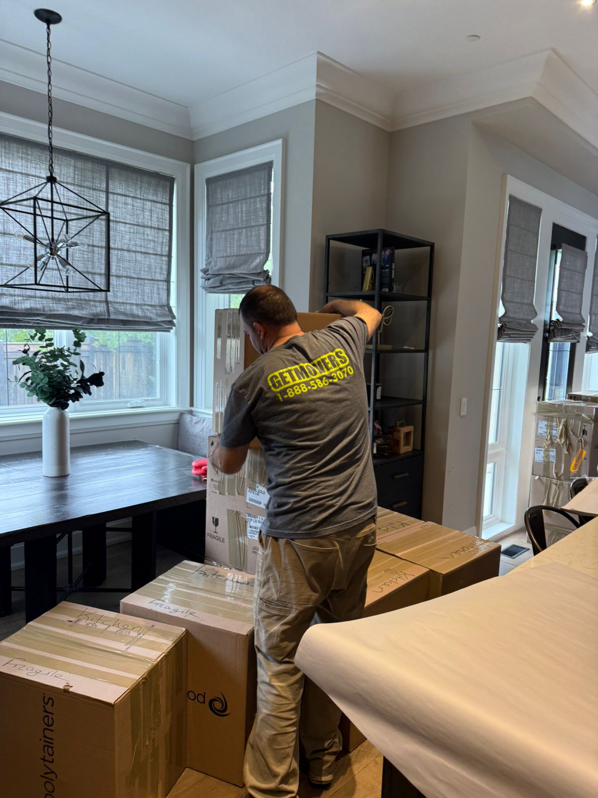 Crew unloading and protecting belongings during the move