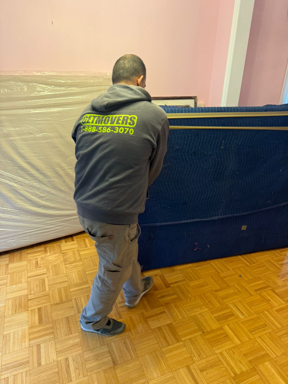 Movers loading boxes from a Kingswood Dr home