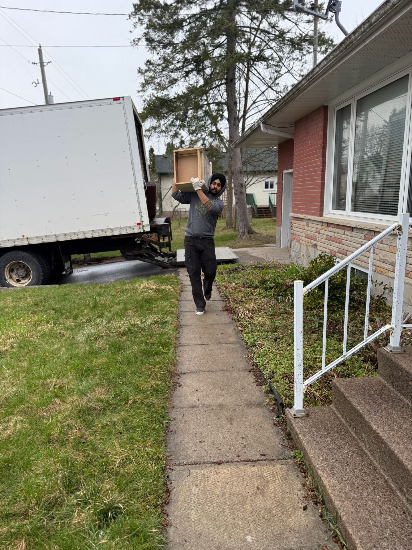 Movers loading items in West Hill