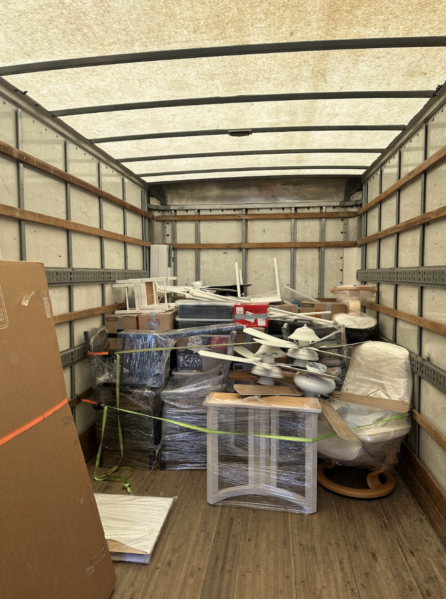 North Park condo move — crew wrapping furniture securely