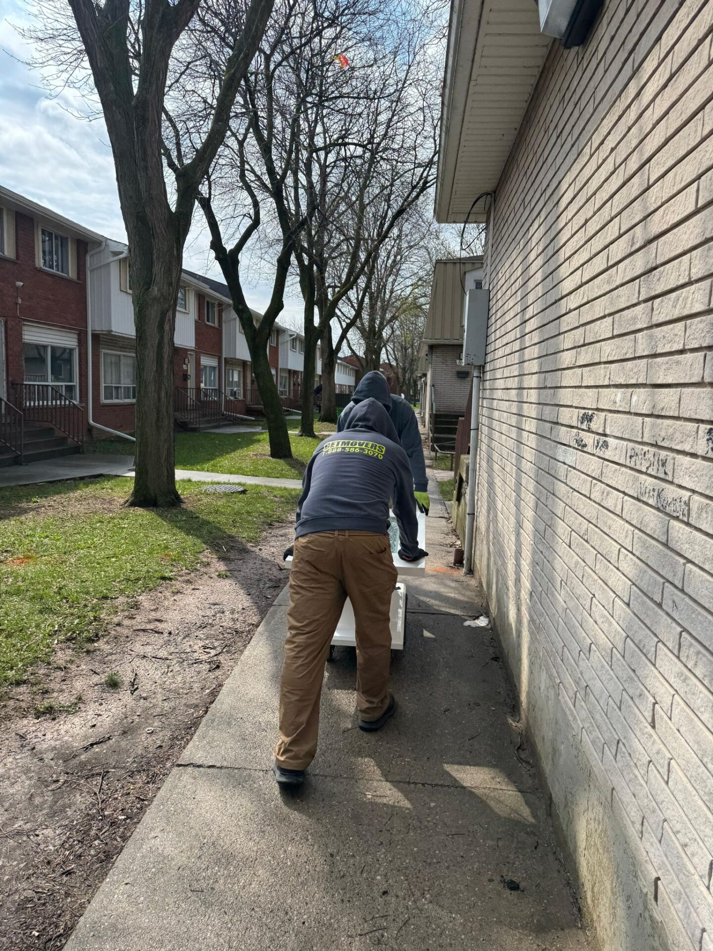 Brantford Commons move completed — crew loading condo