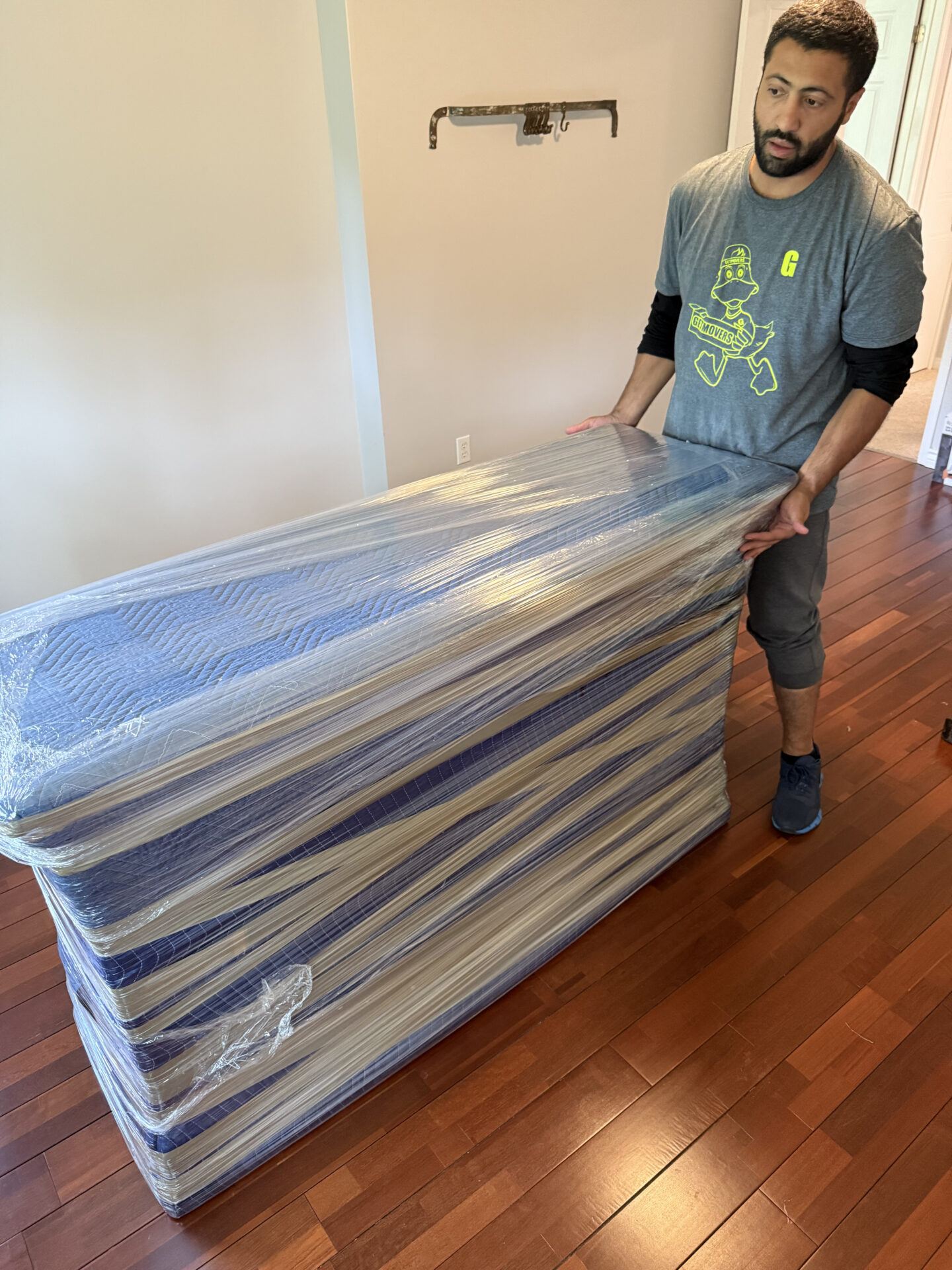 Movers assembling bed frames at destination