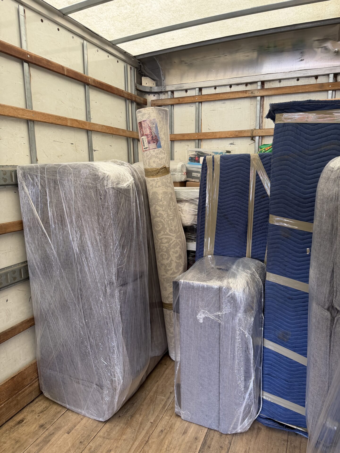 Get Movers crew packing and preparing moving equipment