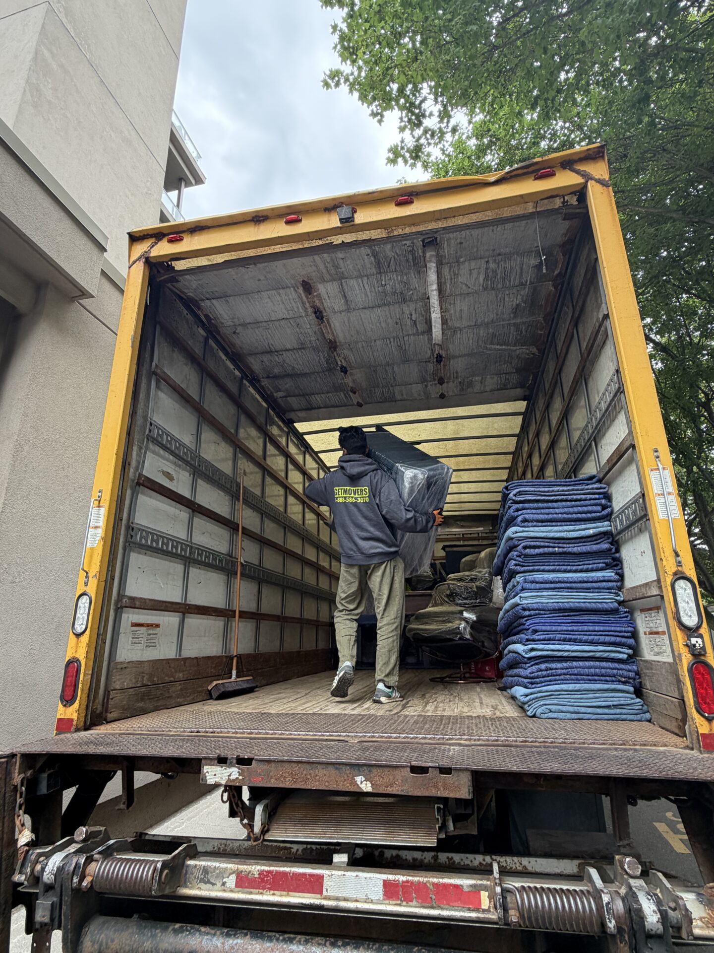 Get Movers Oshawa ON completing a move on Centre St S