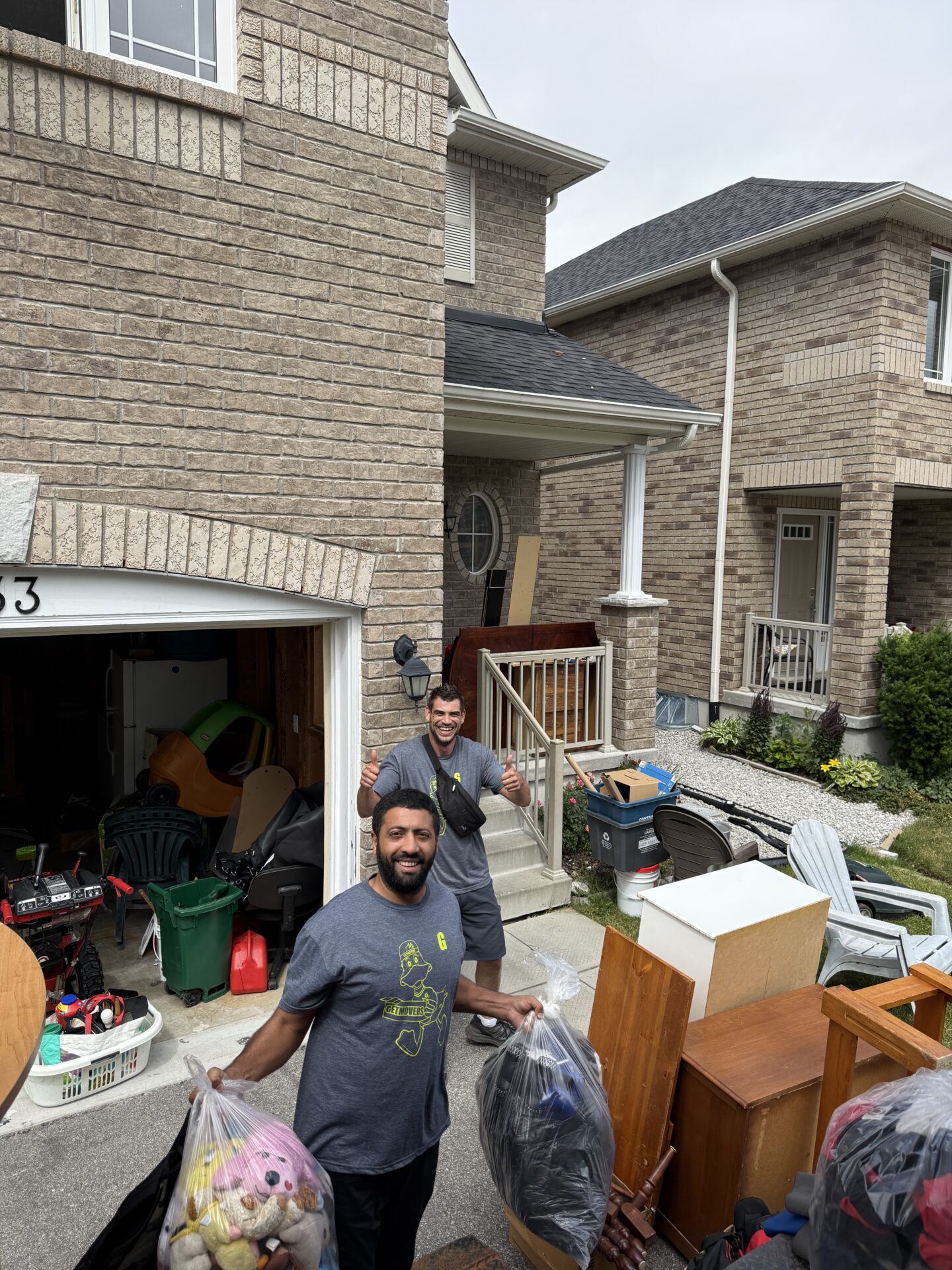 Movers wrapping furniture in Kedron home