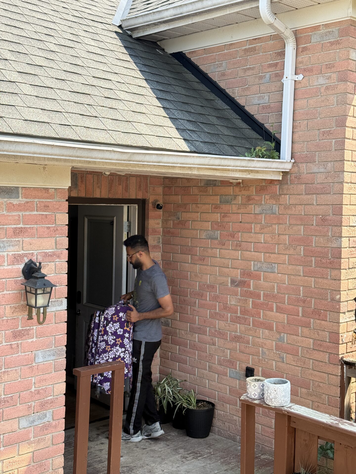 Get Movers Oshawa ON loading boxes from Beaton property