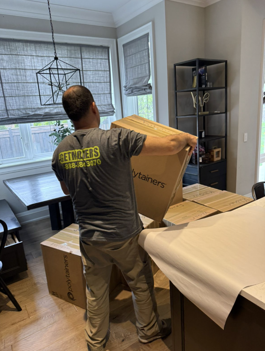 Movers wrapping furniture in Antigonish house
