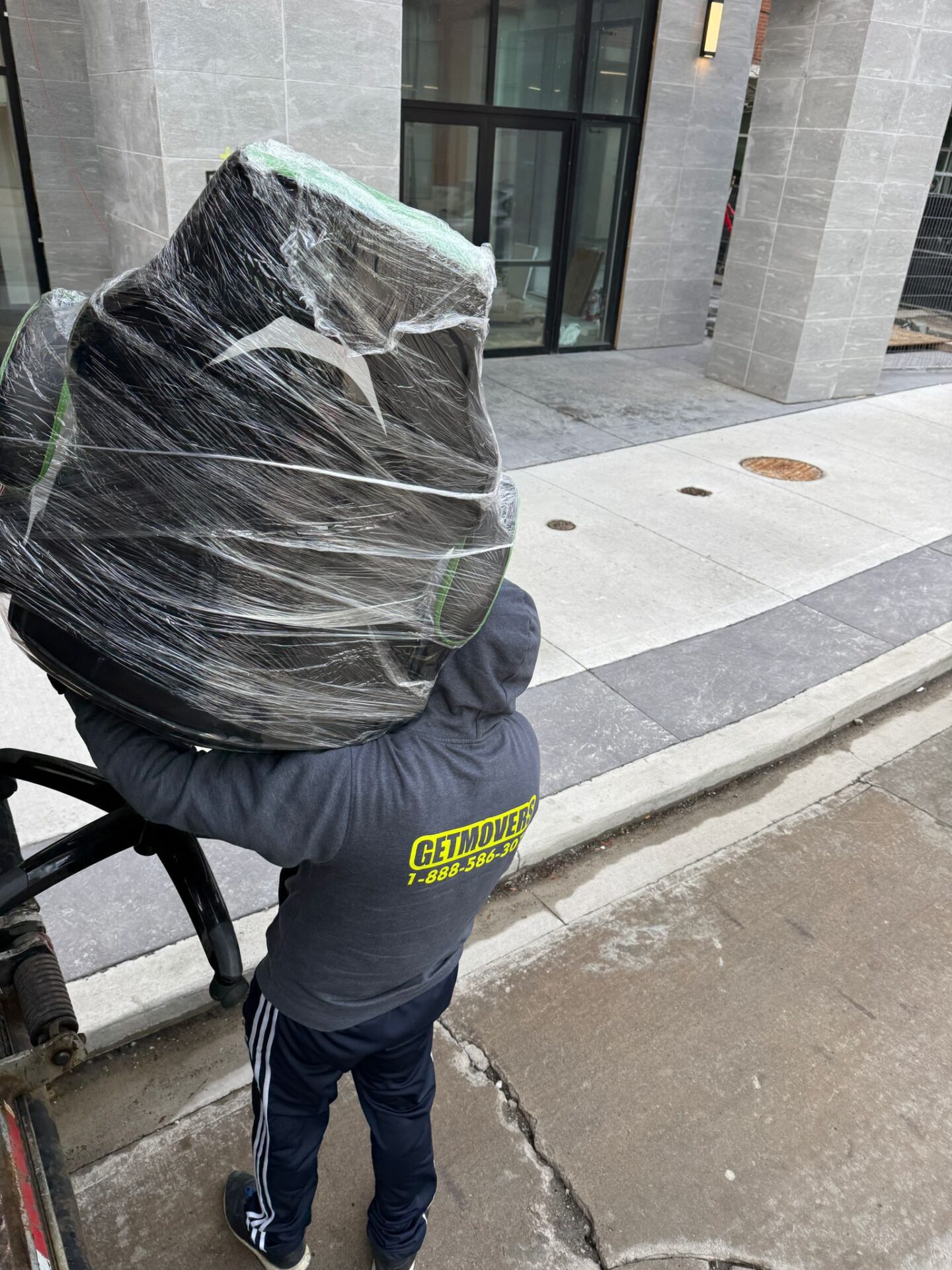 Get Movers Toronto executing customized packing for fragile OLED TVs in a Bay Street Corridor condo