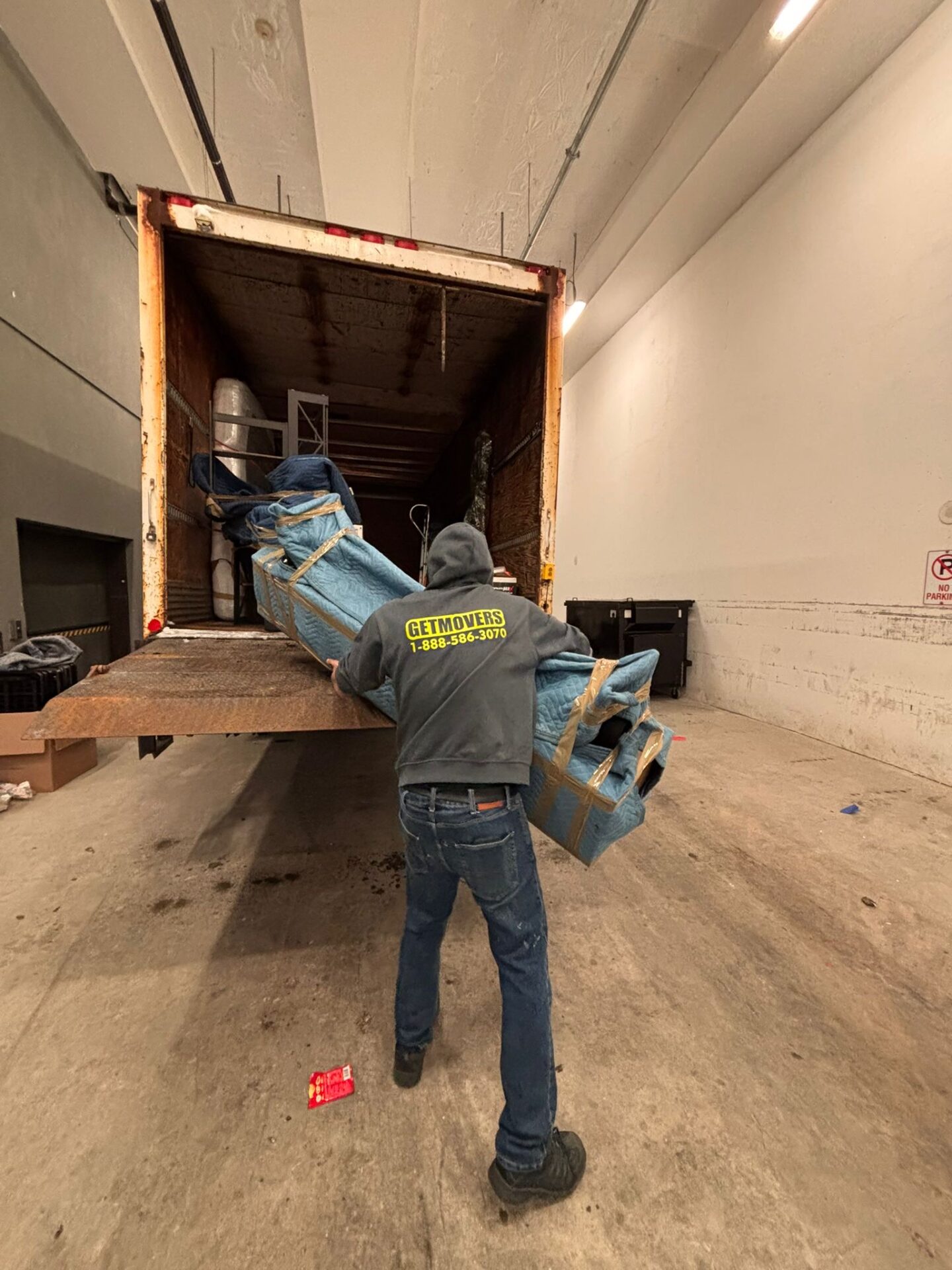 Get Movers Calgary AB team executing safe 26-foot truck staging protocols for residential moving services in a narrow Silverado cul-de-sac