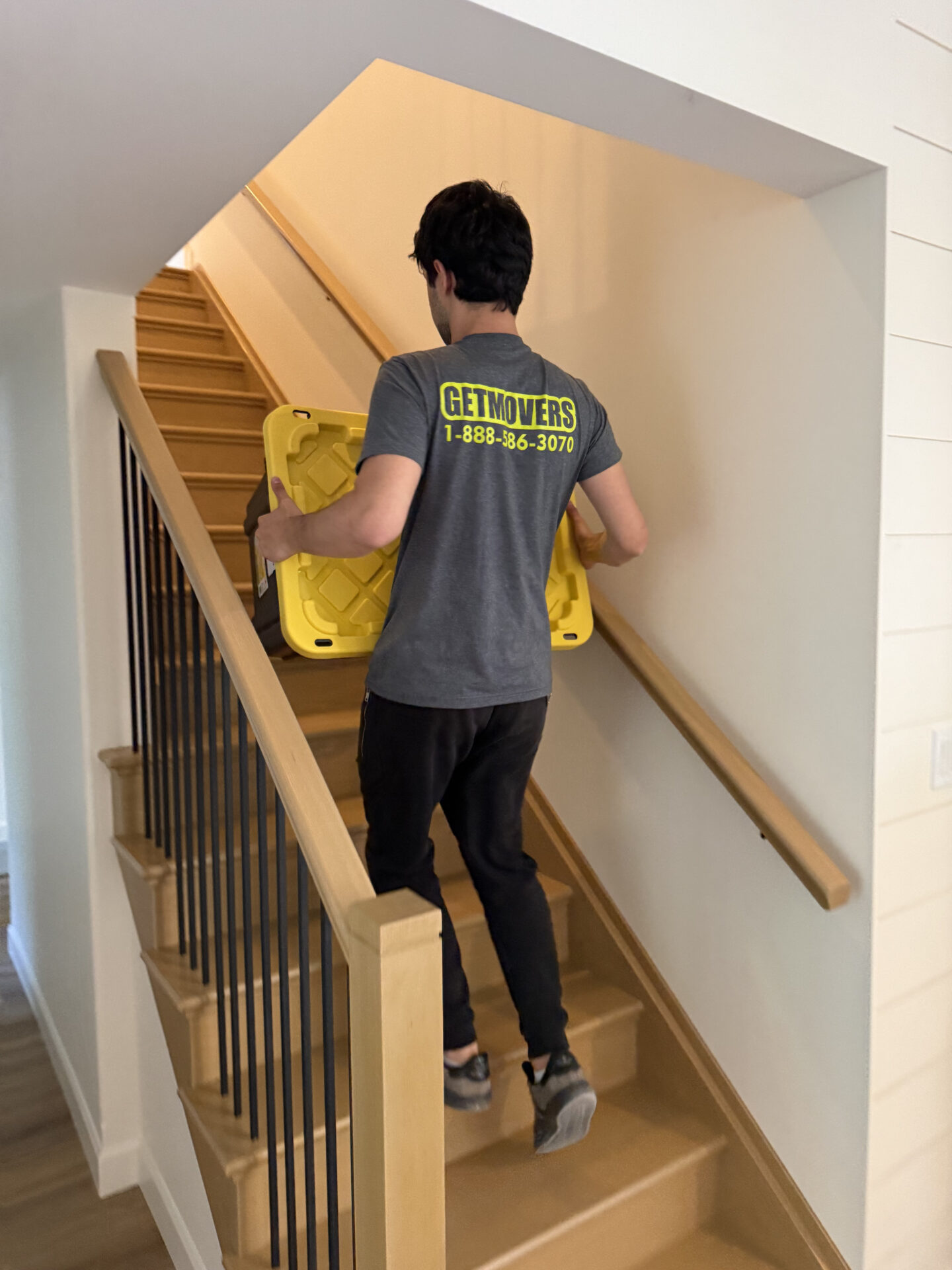 Movers navigating stairs carefully