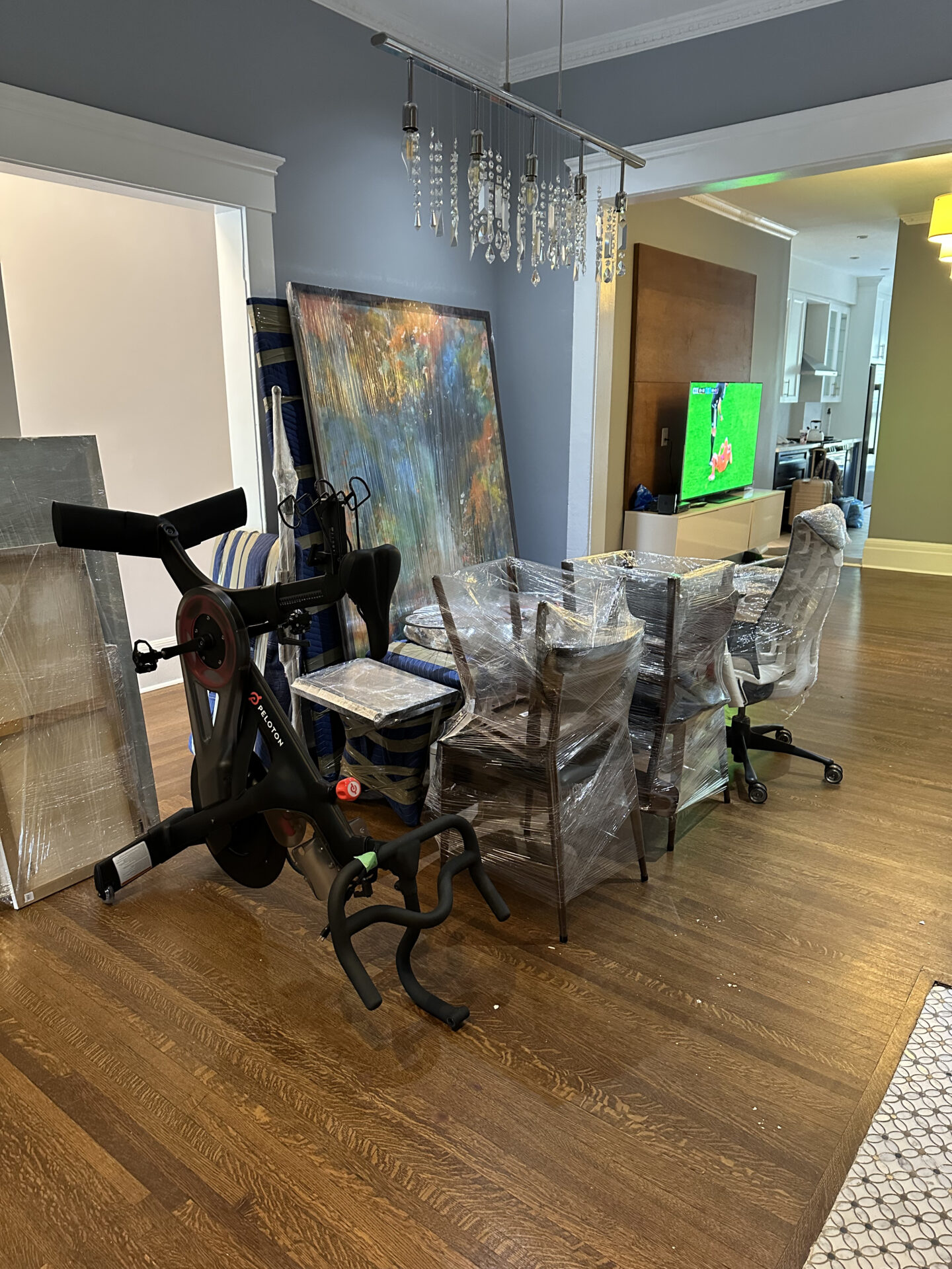 Movers wrapping antique furniture safely