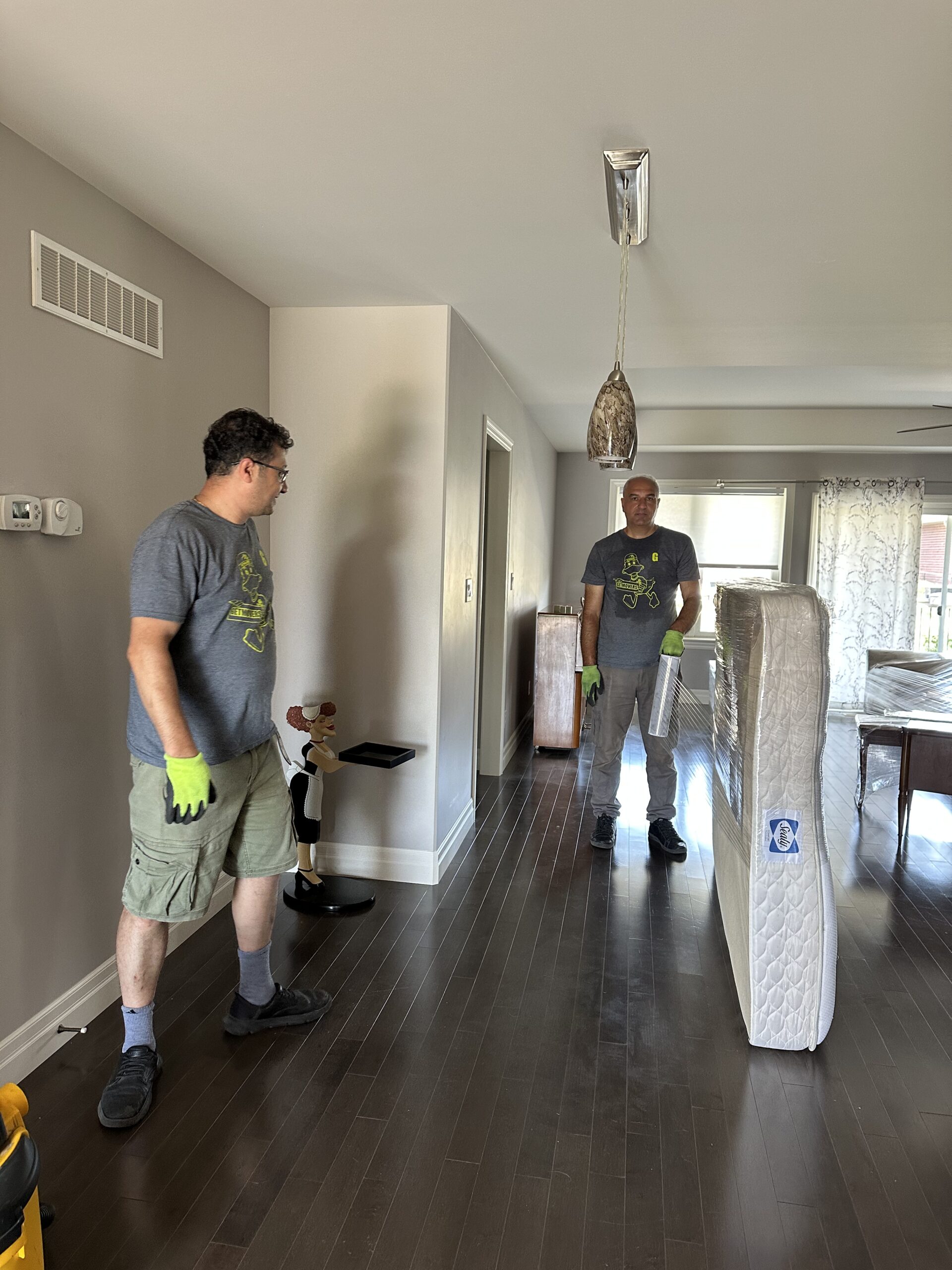 Movers wrapping furniture in Richmond Hill