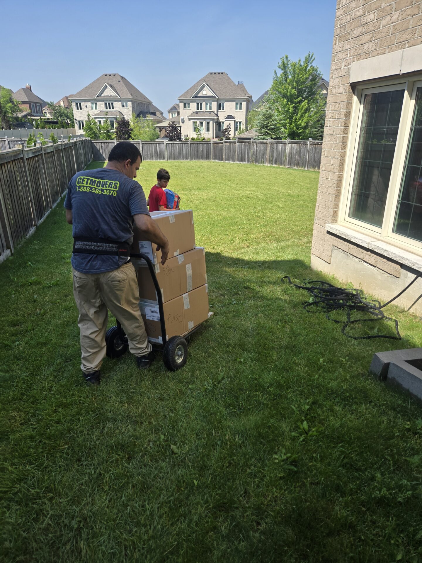 Professional home movers handling boxes on Lakeview Park Ave
